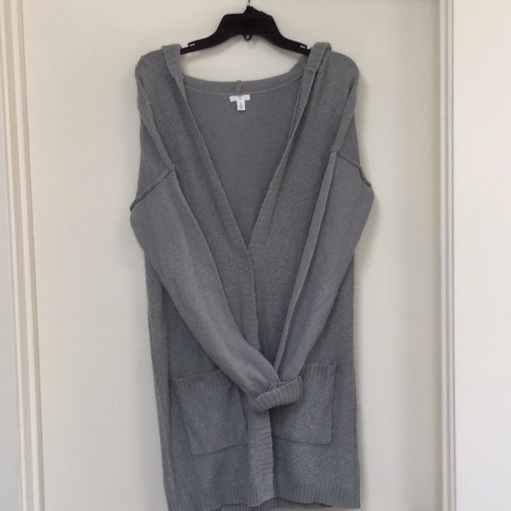 Mid length hooded gray sweater.